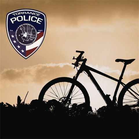 Silhouette of a bicycle in the background and a TPD logo in the foreground