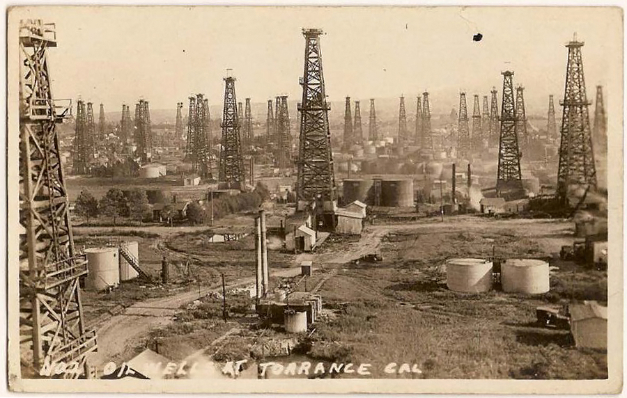 Historical black and white photo of Torrance oil wells