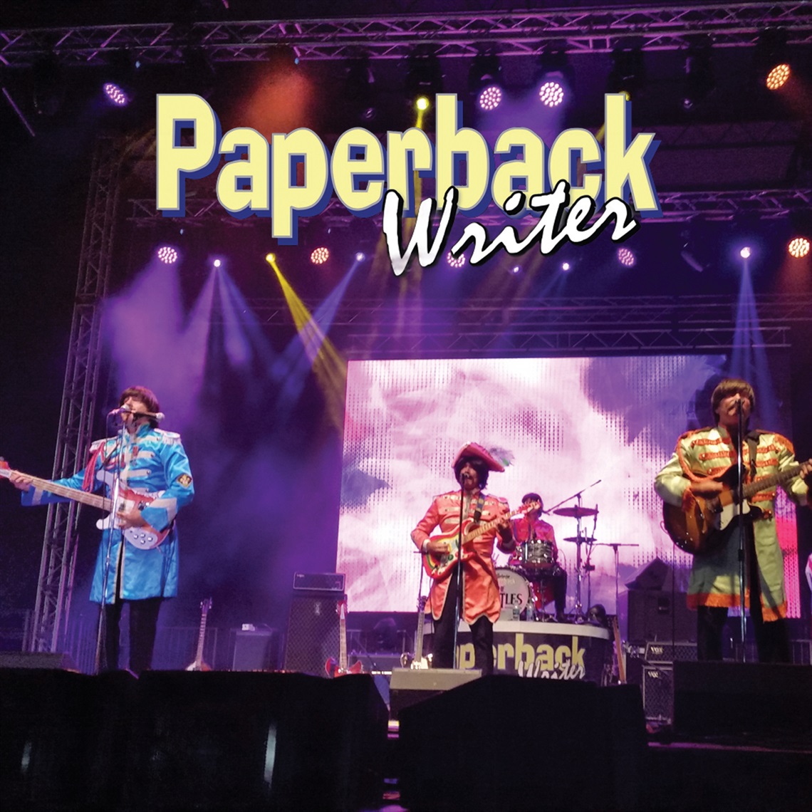 Image of a band on a stage with text Paperback Writer