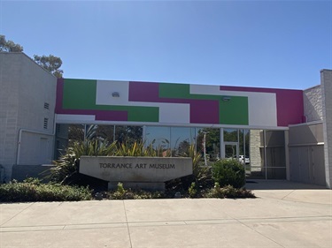 Untitled mural by Jan van der Ploeg at the Torrance Art Museum featuring green, pink, and white color blocks in a stepped geometric pattern.