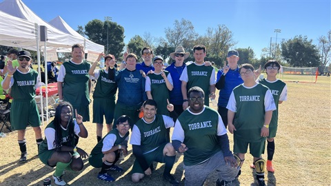 Group of young adult players gathered on a sideline
